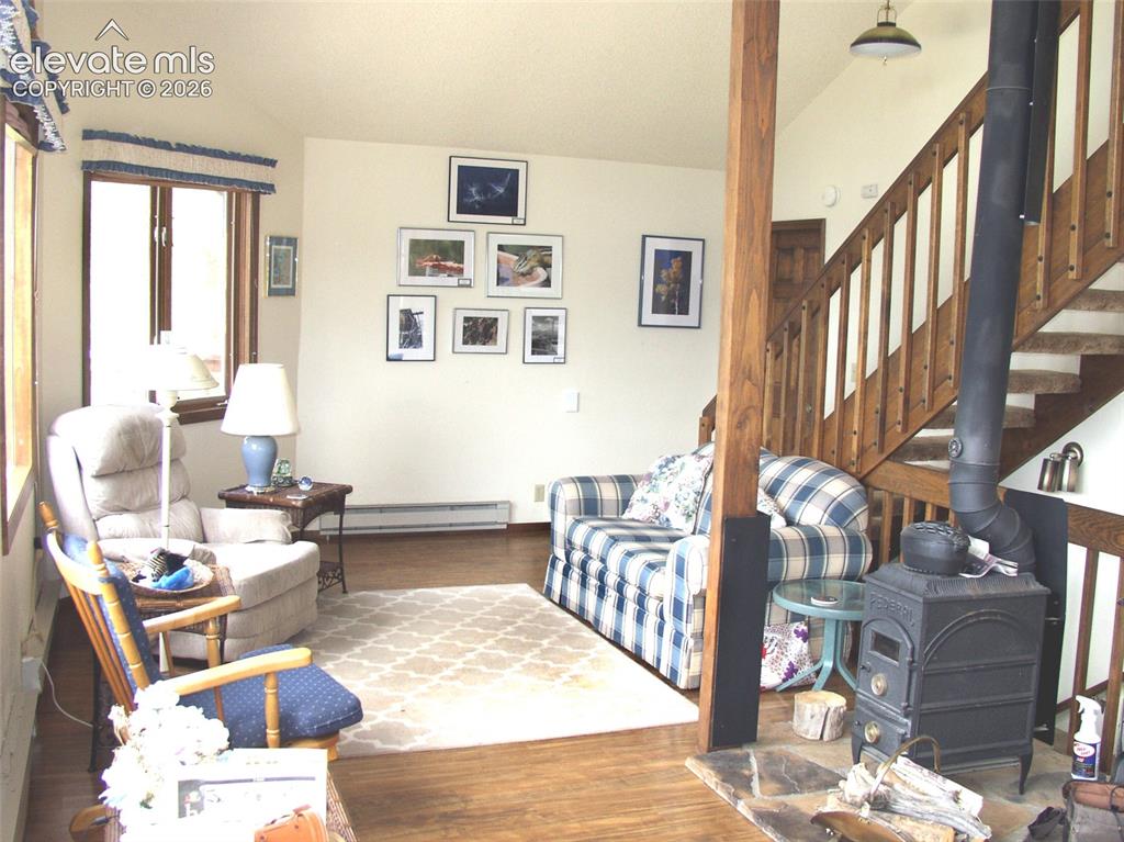Image 21 of 33: on main level, with stairway to loft area.