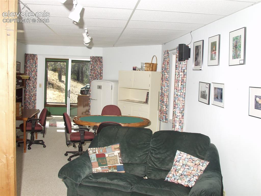 Image 26 of 33: in Basement, w/ walk-out to lower, deck.