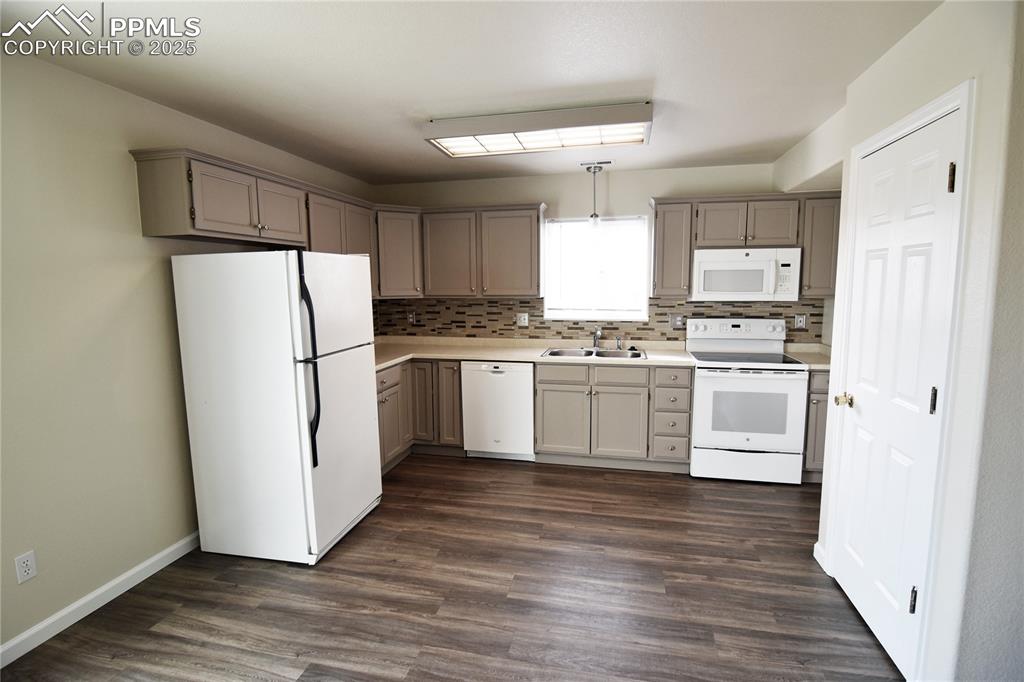 Image 8 of 16: Dishwasher, range/oven, microwave vent hood and refrigerator