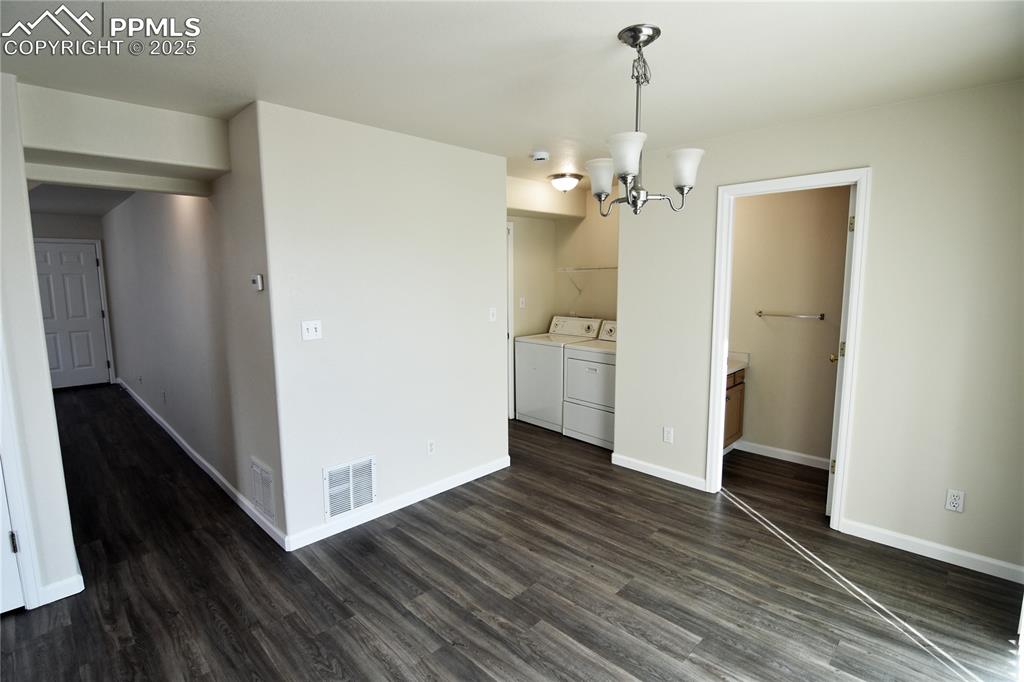 Image 9 of 16: Dining nook, laundry (washer & dryer included) and powder room