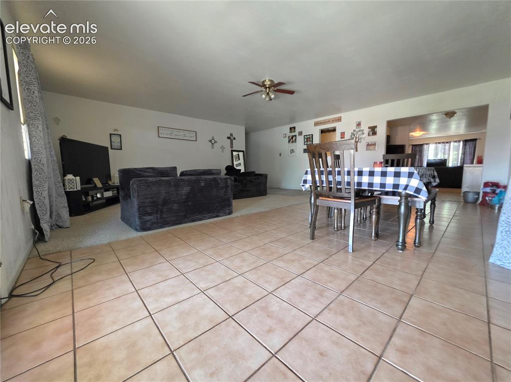Image 10 of 39: Formal Dining room and Family room