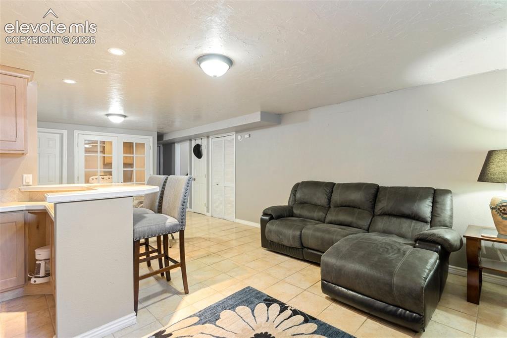 Image 17 of 24: View of tiled living room