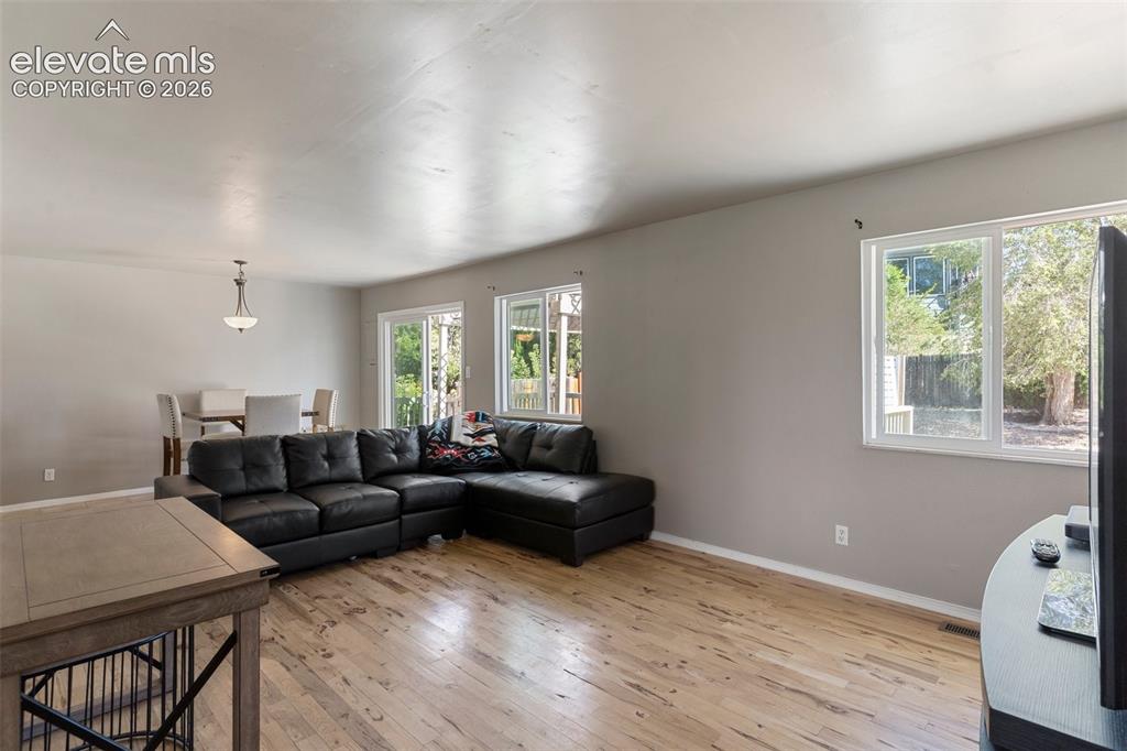 Image 3 of 24: Living room featuring plenty of natural light and light wood-type flooring
