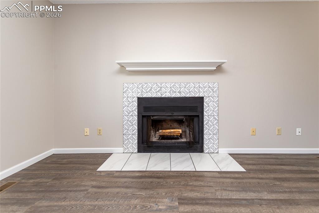 Image 20 of 31: Wood Fireplace.