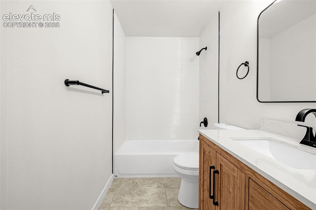 Image 18 of 48: Upper Level Bathroom. Attached to Primary Bedroom and has hall access.