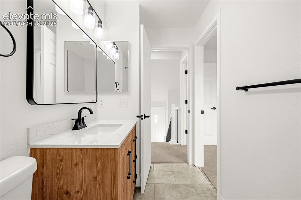 Image 19 of 48: Upper Level Bathroom. Attached to Primary Bedroom and has hall access.