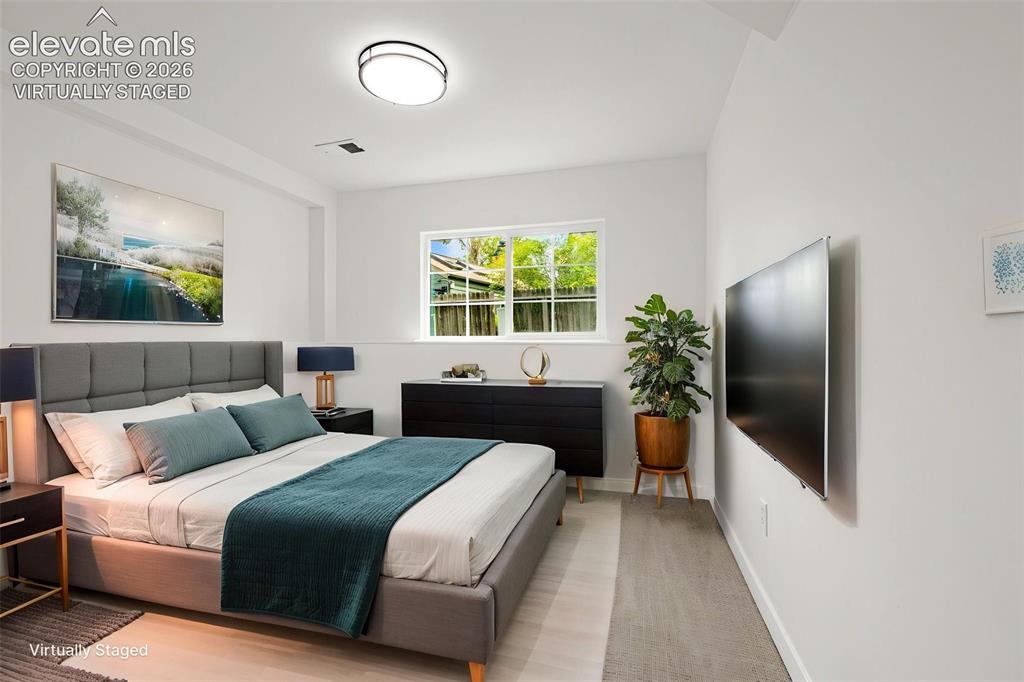 Image 27 of 48: Virtually Staged Basement Bedroom