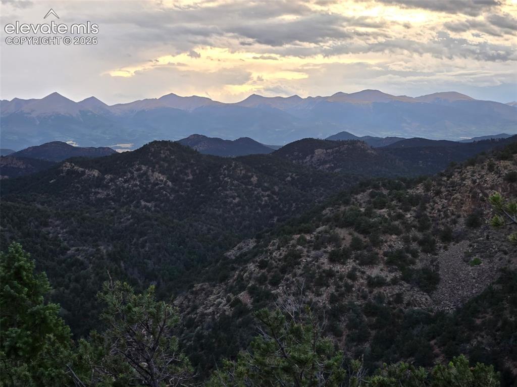 Image 3 of 33: Expansive mountain range backdrop with natural terrain and abundant greener