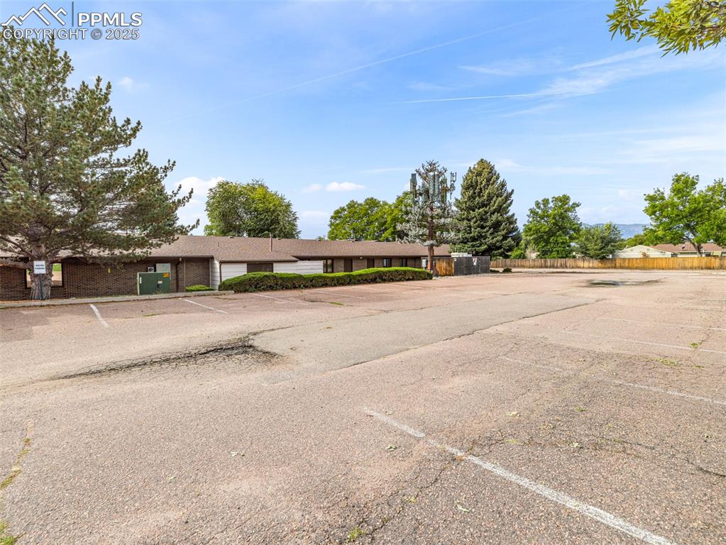 Image 14 of 49: View of front of property featuring uncovered parking