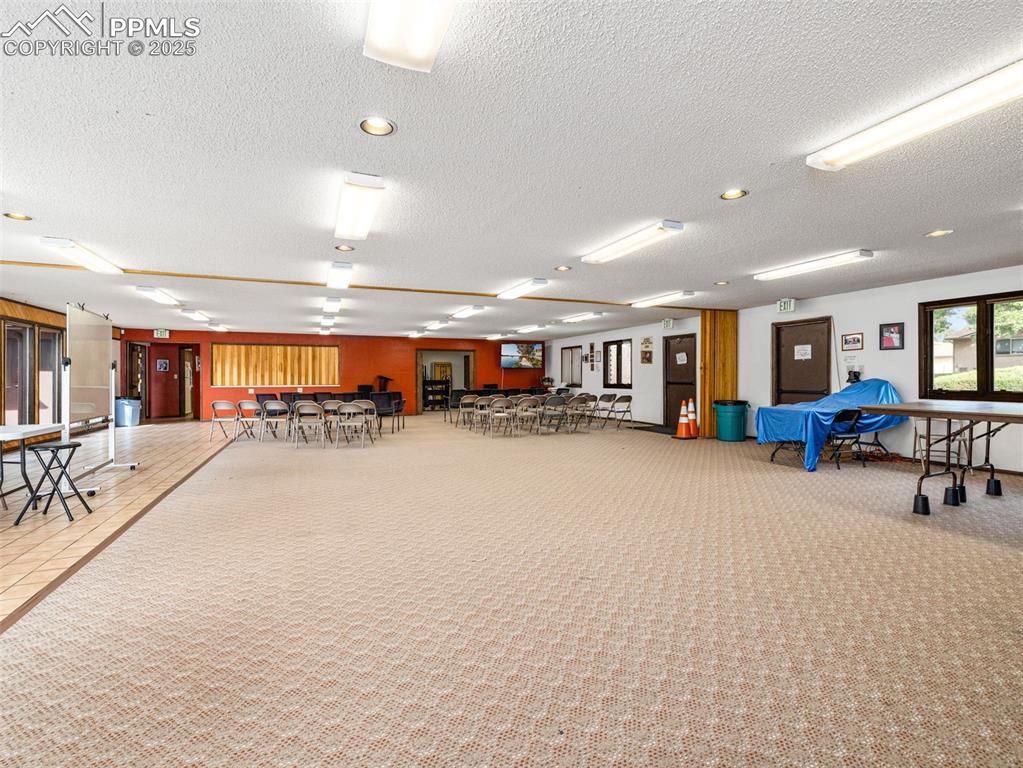 Image 22 of 49: Miscellaneous room featuring a textured ceiling