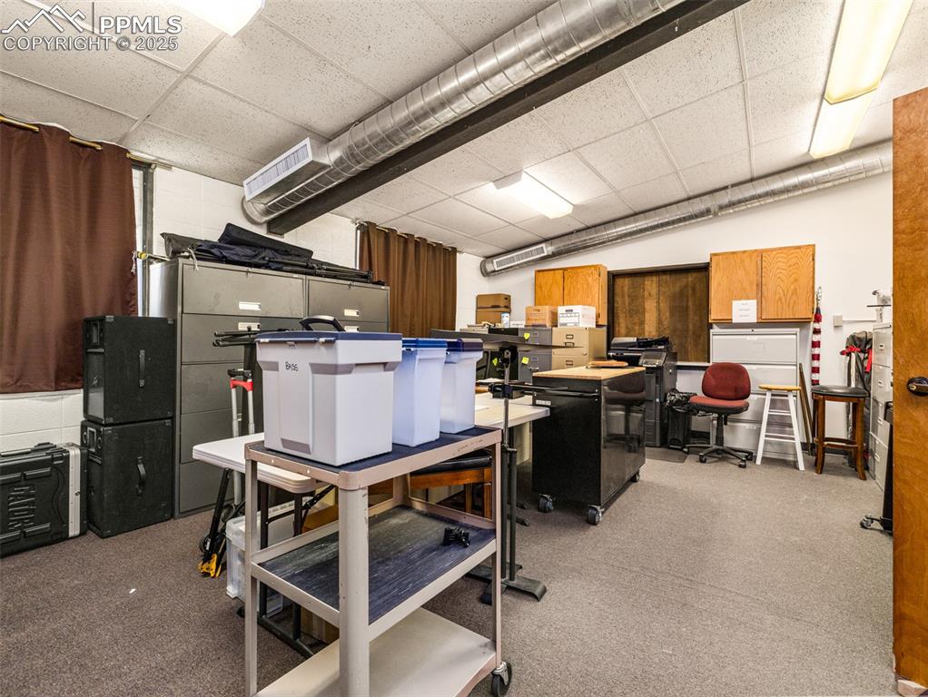Image 37 of 49: Basement featuring a drop ceiling