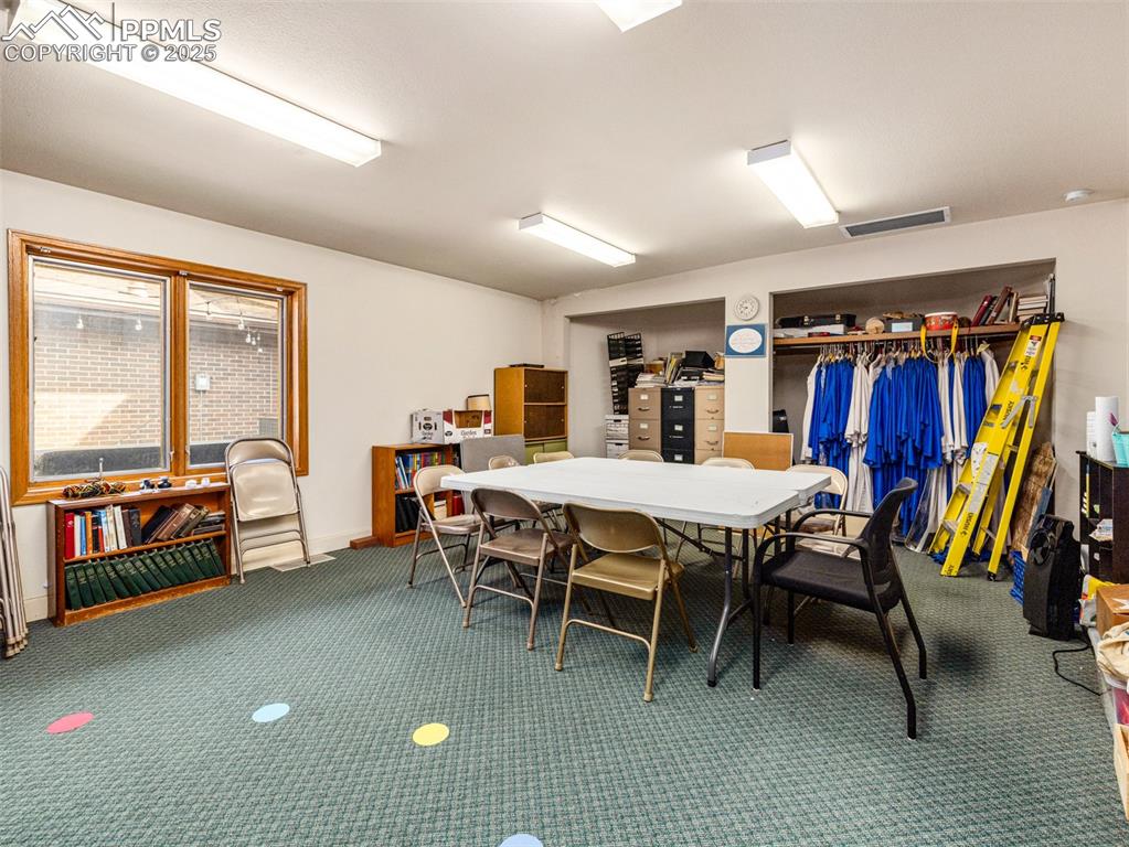 Image 39 of 49: Dining space featuring carpet floors and baseboards
