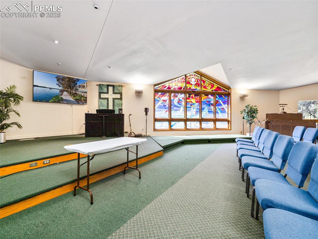 Image 42 of 49: View of carpeted living area