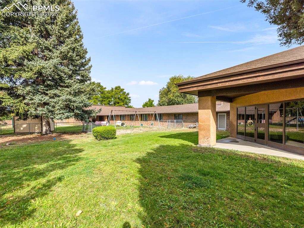 Image 7 of 49: View of yard with a patio