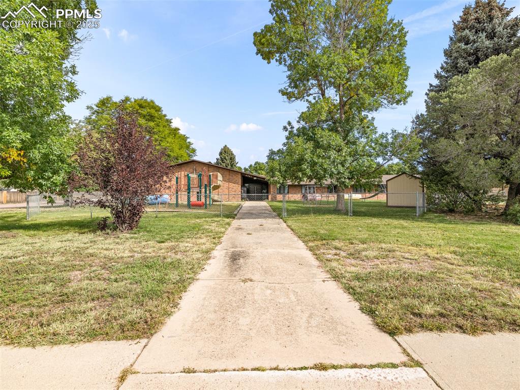 Image 8 of 49: View of front of property with a fenced front yard