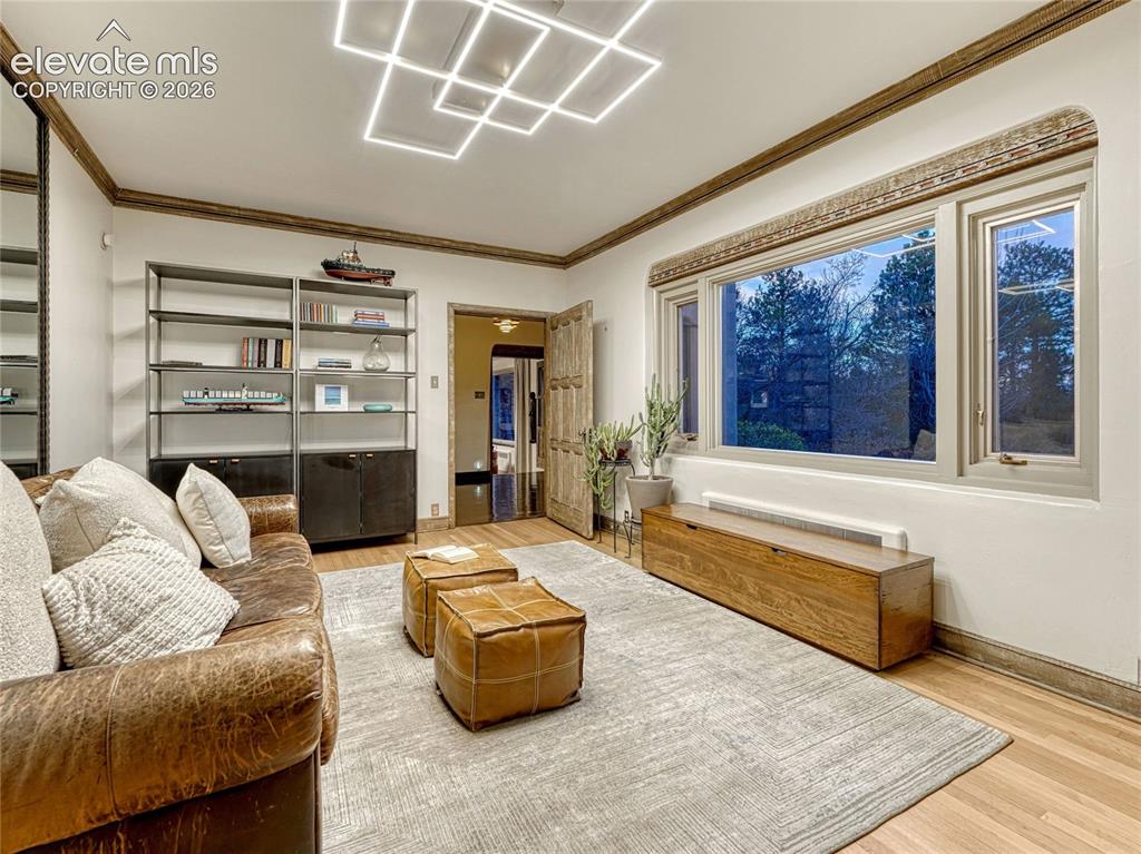 Image 19 of 50: Informal dining space/office/lounge area connected to kitchen.