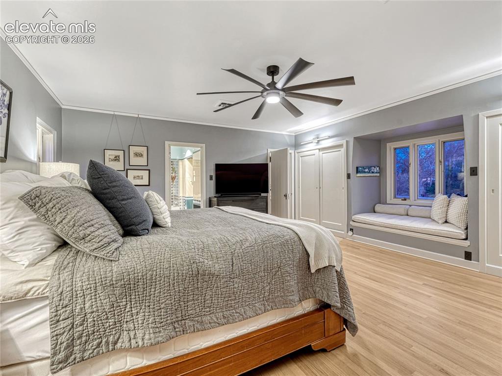 Image 24 of 50: Primary Suite w/dual closets, window seat, dressing area w/additional wardr