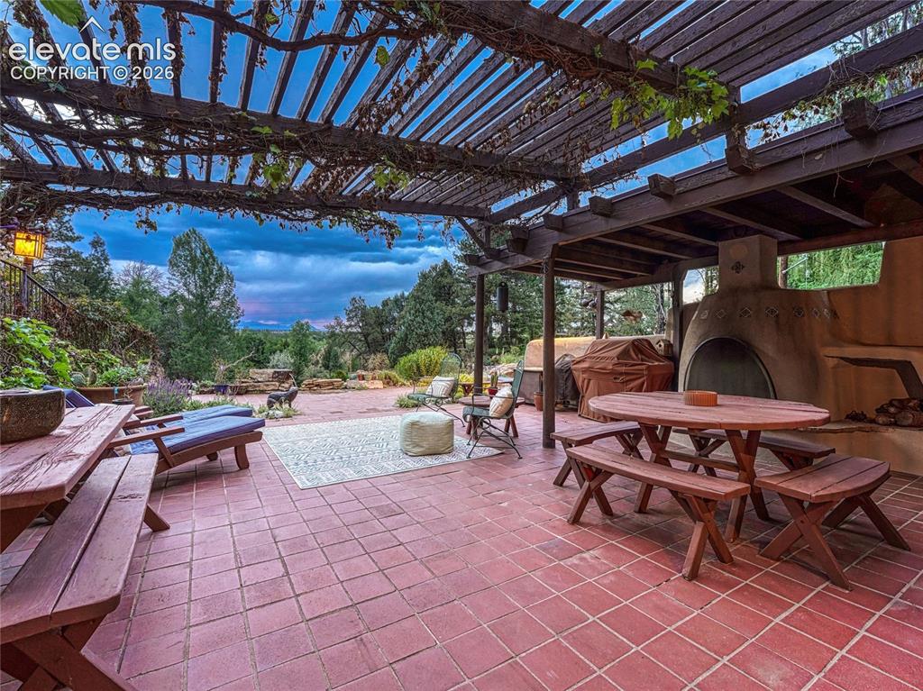 Image 3 of 50: Multiple outdoor spaces for entertaining and quiet retreat