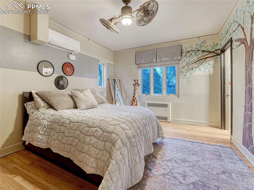 Image 31 of 50: Original hardwood flooring throughout.