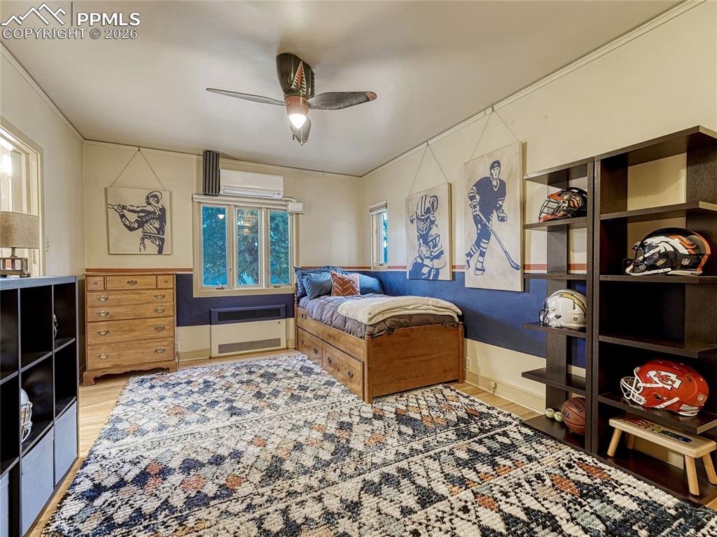 Image 34 of 50: Bedroom on main level with shared bath.