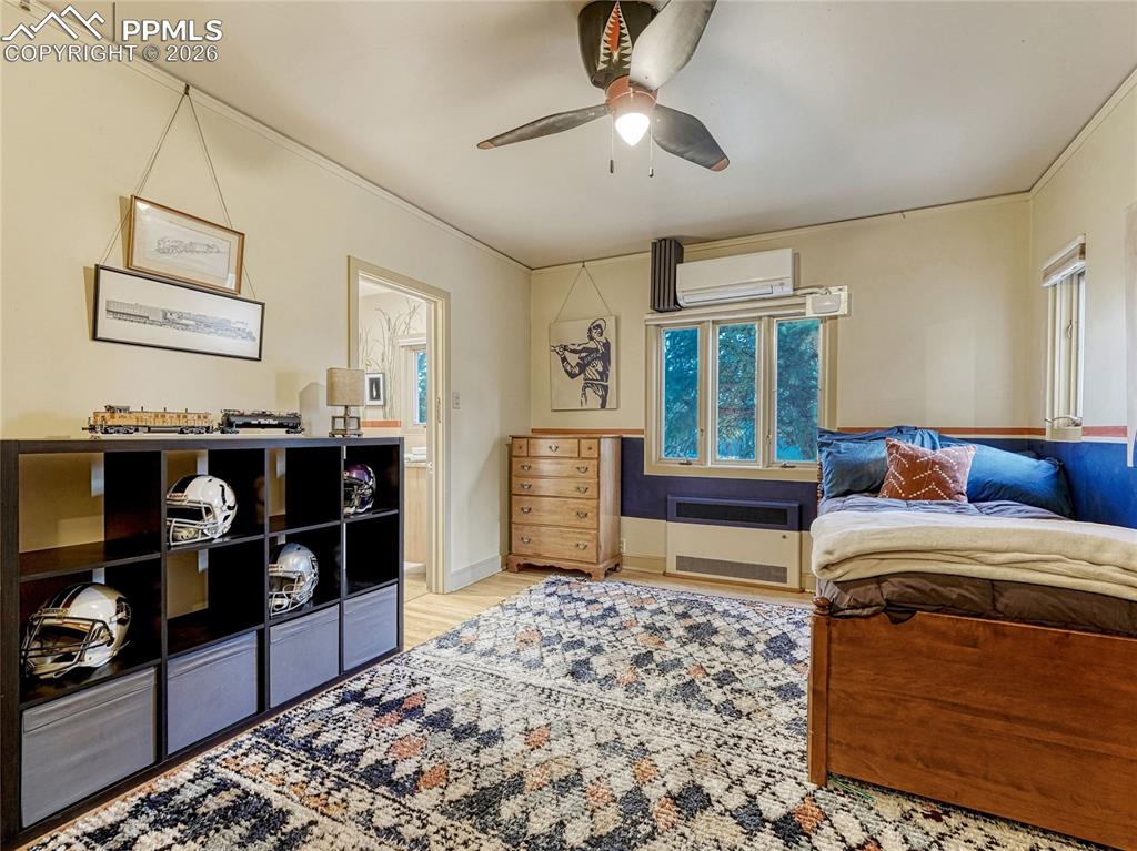 Image 35 of 50: Bedroom on main level with shared bath.