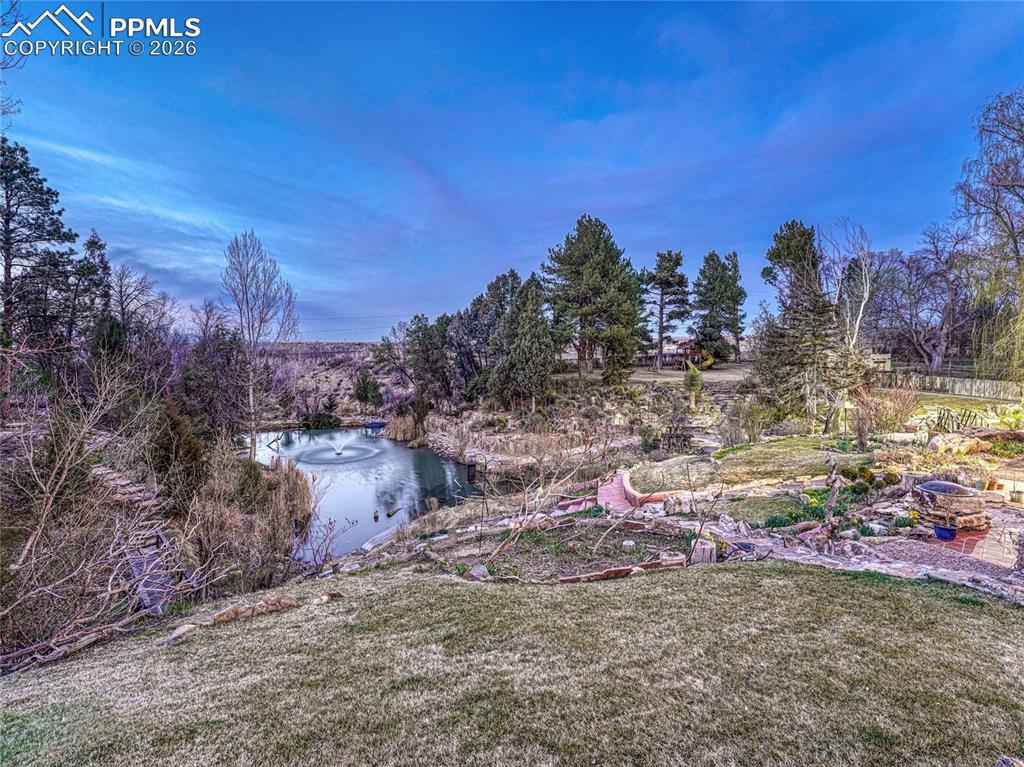 Image 43 of 50: Lower Level Family Room with terra cotta tile.