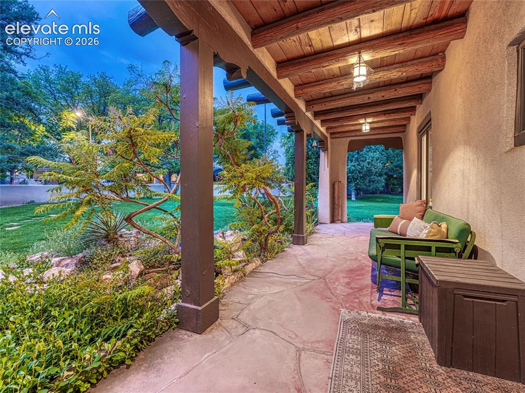 Image 5 of 50: Warm, welcoming entry with authentic architectural detail