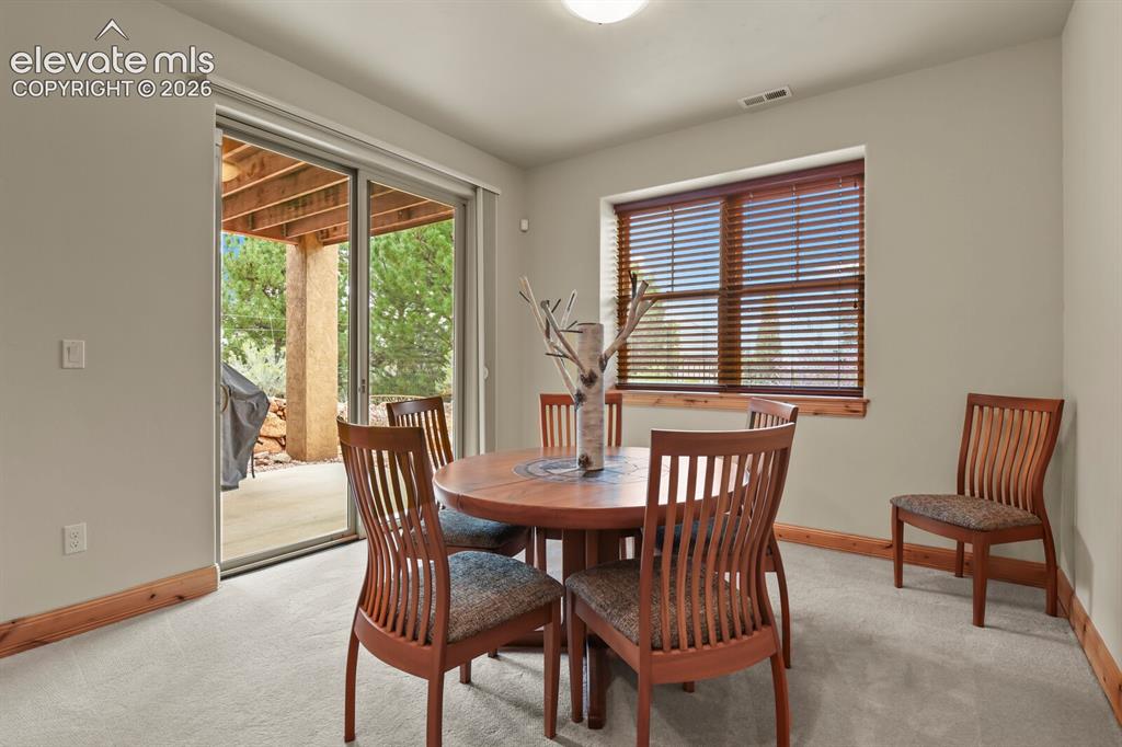 Image 28 of 48: Basement rec room with walk-out to the backyard