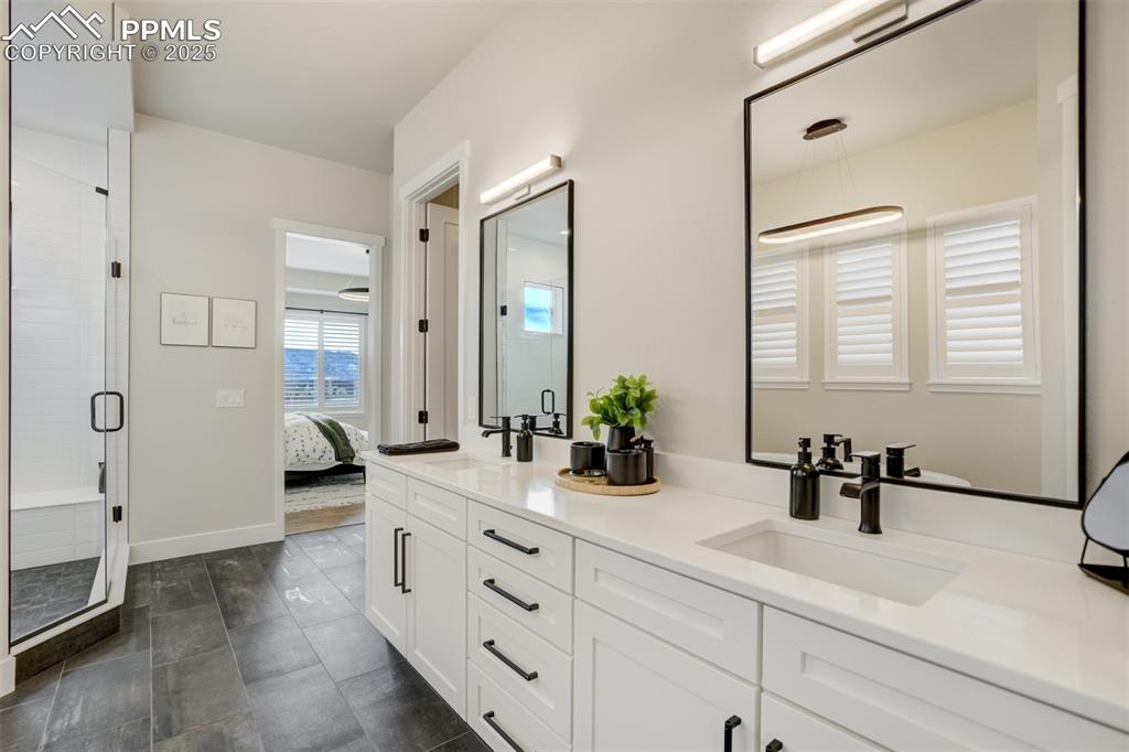 Image 22 of 47: Master bath featuring large shower w/seat, freestanding soaking tub, double