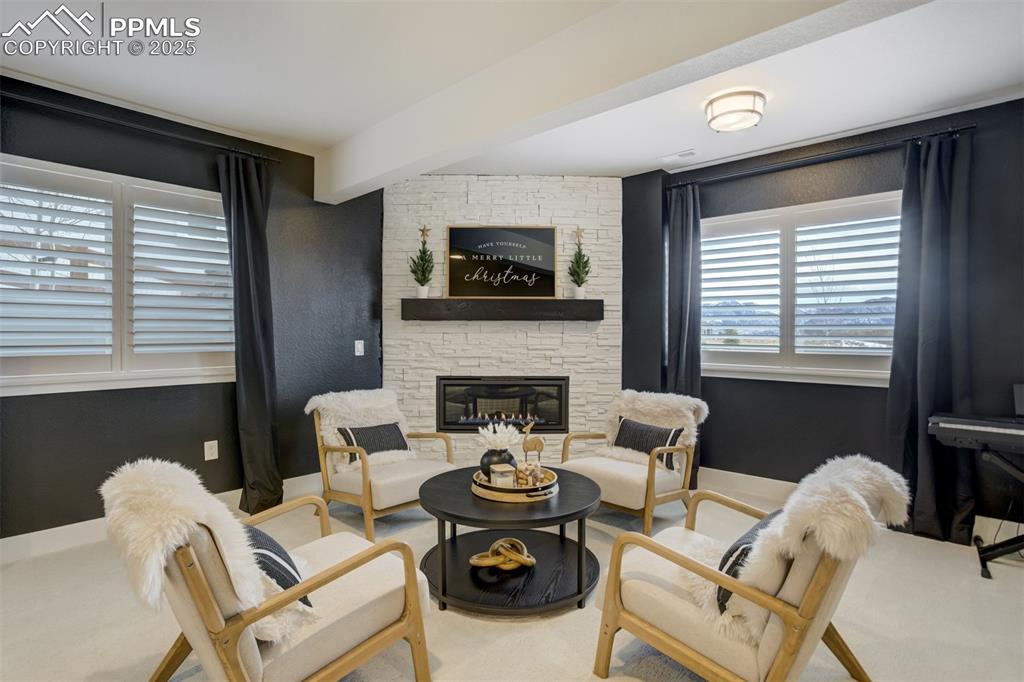 Image 30 of 47: Cozy up to the second gas fireplace inside the home