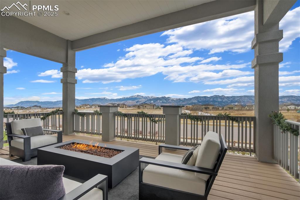 Image 36 of 47: Pikes Peak views from the covered main level composite deck