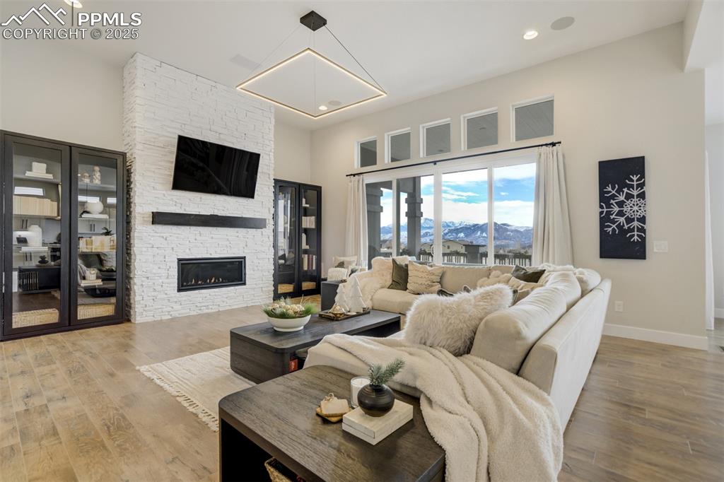 Image 9 of 47: Gas fireplace with stacked stone surround