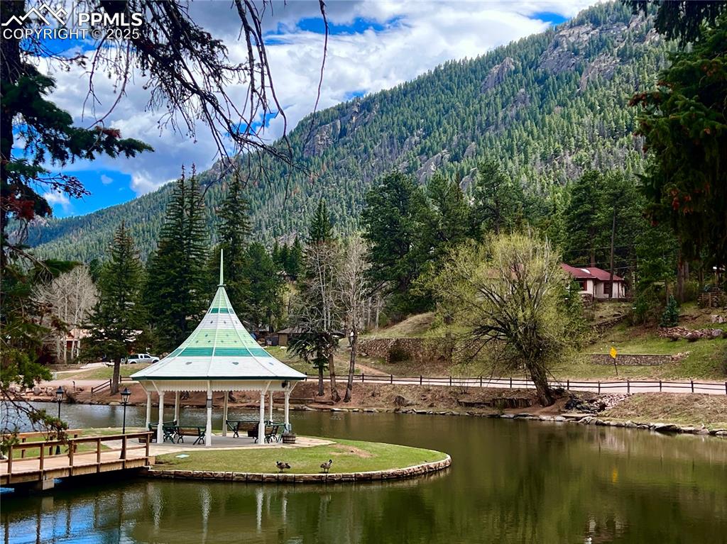 Image 49 of 50: Gazebo and pond located im Green Mtn Falls