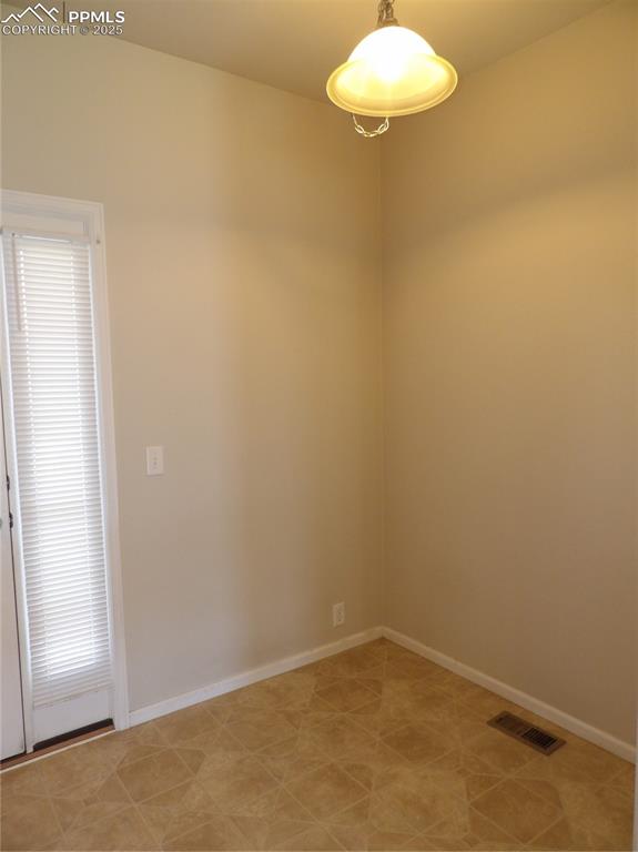 Image 11 of 20: Unfurnished room featuring baseboards