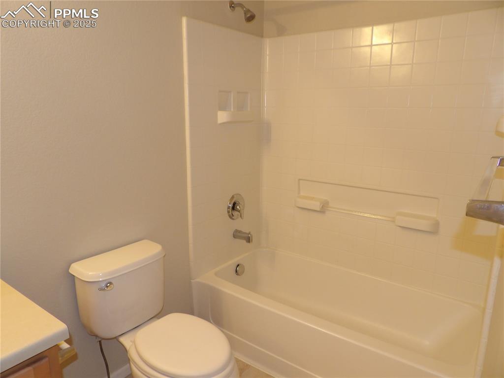 Image 19 of 20: Bathroom featuring bathing tub / shower combination and vanity