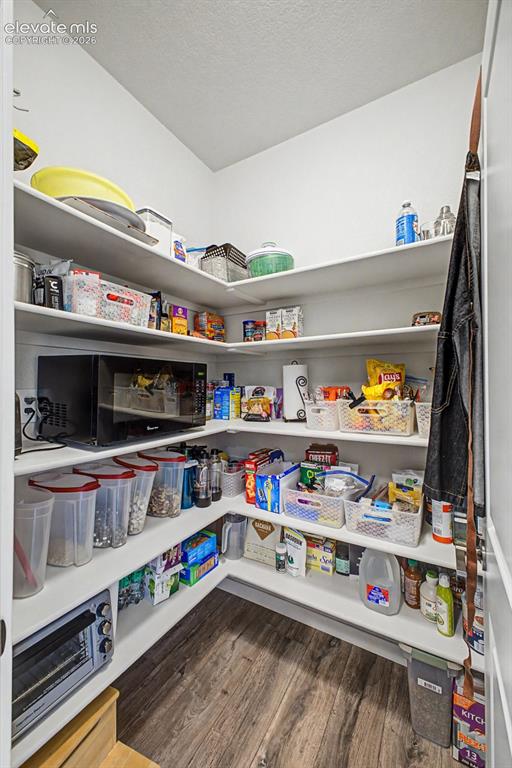 Image 18 of 50: Large walk in pantry