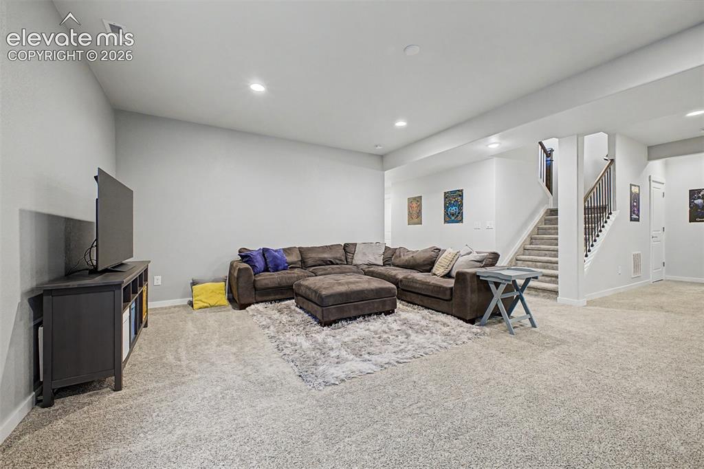 Image 39 of 50: Media room with fireplace basement