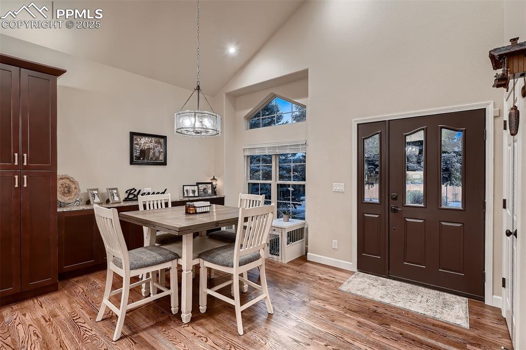 Image 4 of 28: Front entry into the dining room and newly remodeled kitchen.