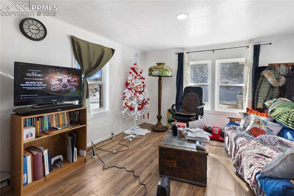 Image 12 of 37: The living area with wood finished floors and plenty of natural light!