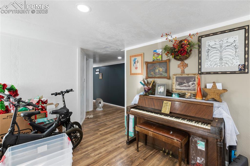 Image 13 of 37: The living area with wood finished floors!