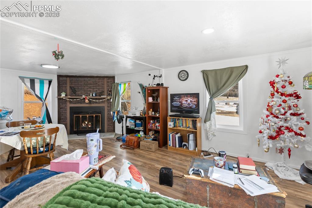 Image 15 of 37: The living area with a wood fireplace!