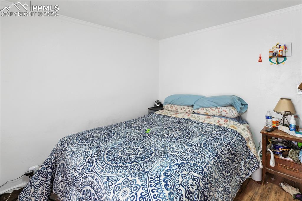 Image 19 of 37: The main bedroom with wood floors!