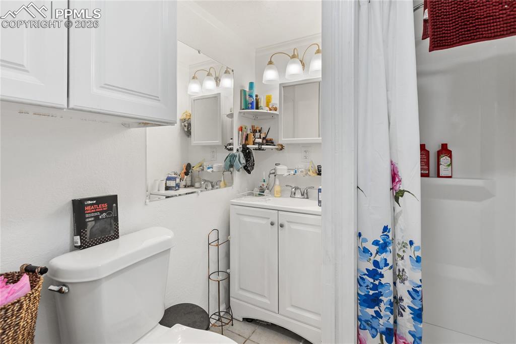 Image 25 of 37: The full bath with a shower and vanity!