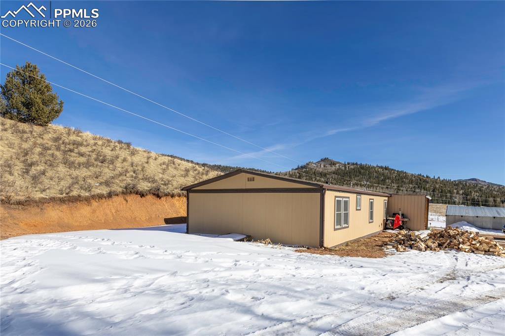 Image 36 of 37: The side of the house and the surrounding hills!