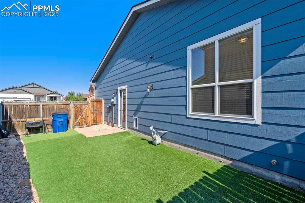Image 41 of 50: View of yard featuring a gate