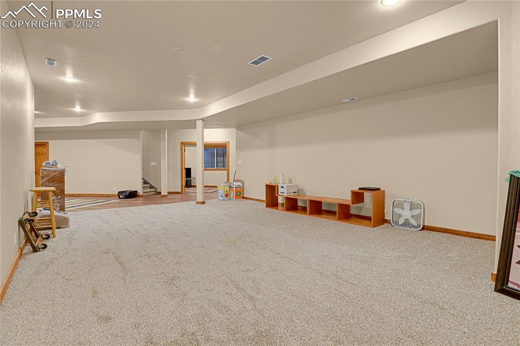 Image 10 of 45: Basement featuring carpet