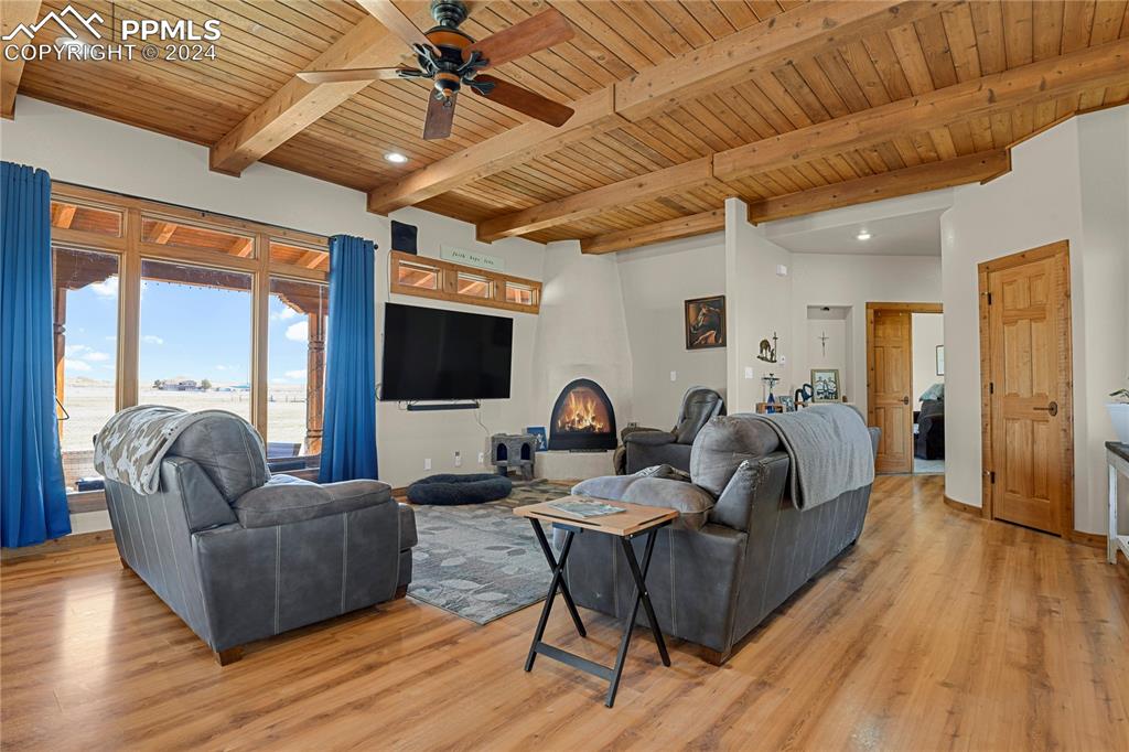 Image 29 of 45: Living room featuring wooden ceiling, ceiling fan, light hardwood / wood-st