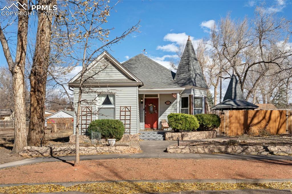 Image 2 of 37: Victorian home featuring a shingled roof and a porch
