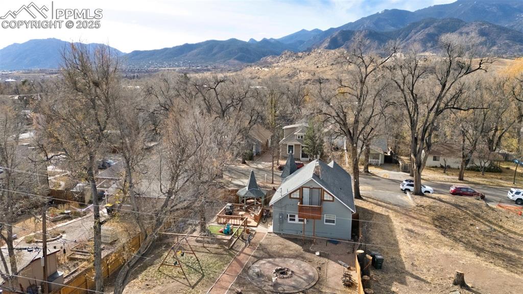 Image 31 of 37: Aerial perspective of suburban area with a mountainous background