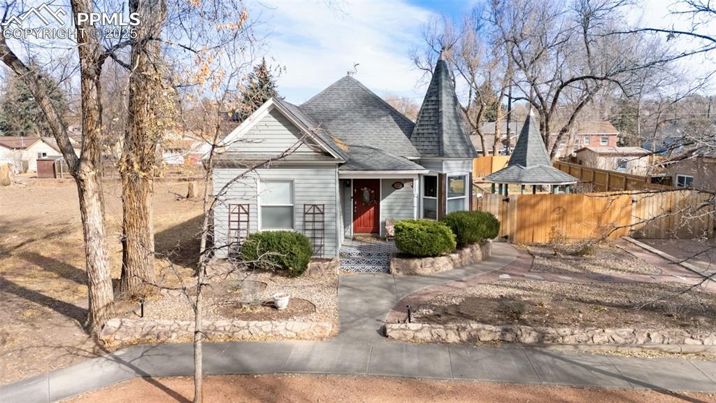 Image 35 of 37: View of front of property with a shingled roof